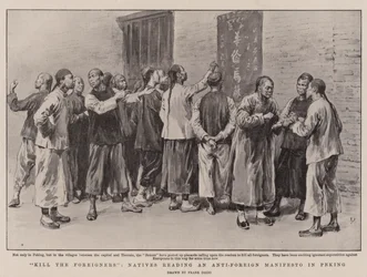 Uccidete gli stranieri, nativi che leggono un manifesto anti-stranieri a Pechino